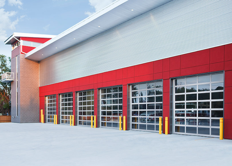 Garage Door Services in Pierce County | Red commercial building with 5 garages