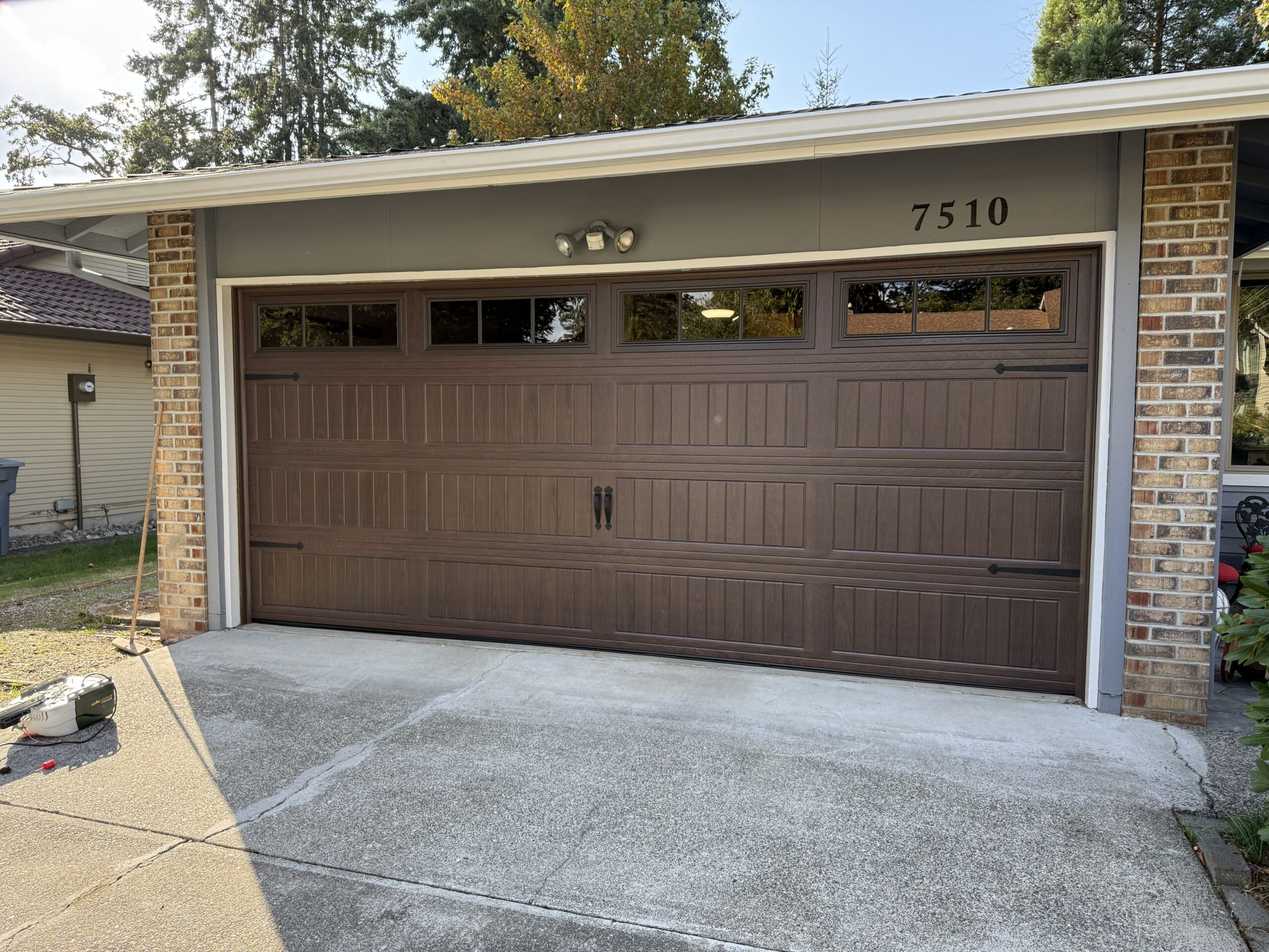 garage door upgrade with a 16x7 Wayne Dalton 8300 Bidirectional Tinted Glass Garage Door | Garage Door Installation