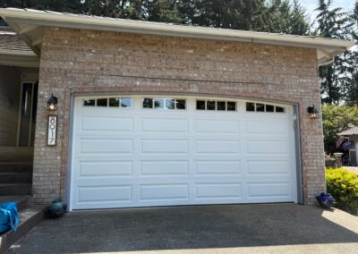 White long panel garage door with glass windows at the top