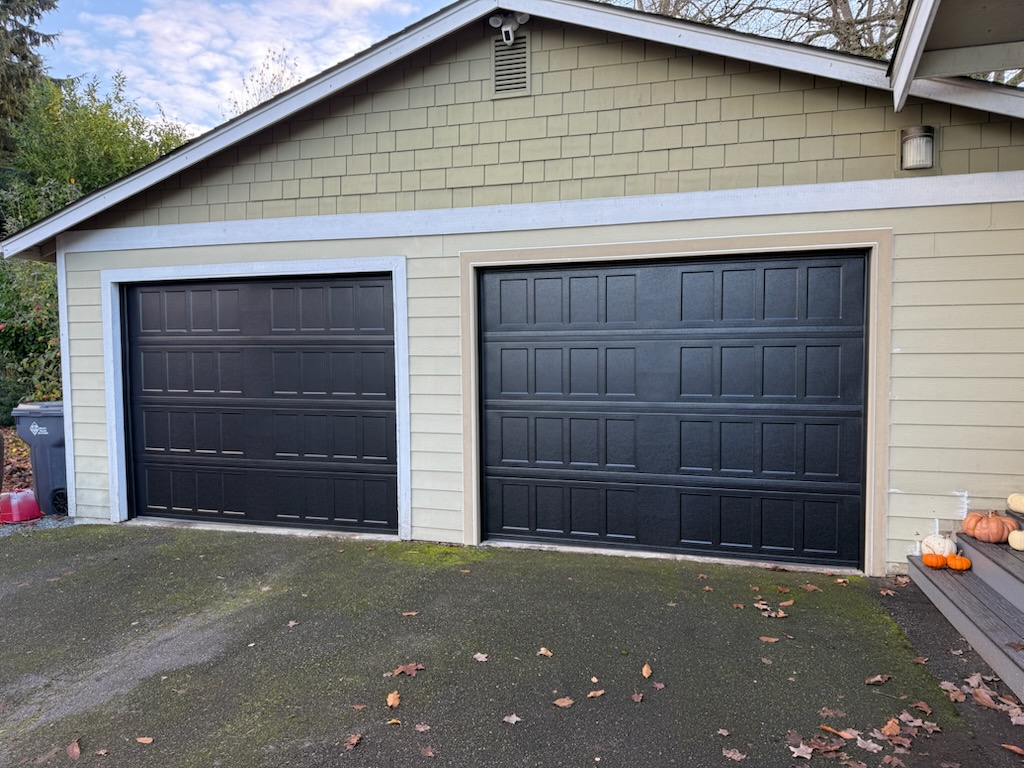 Garage door upgrade with 2 Hormann 9x7 black cottage style doors
