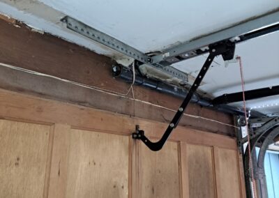 newly replaced garage door track | garage door repair and maintenance